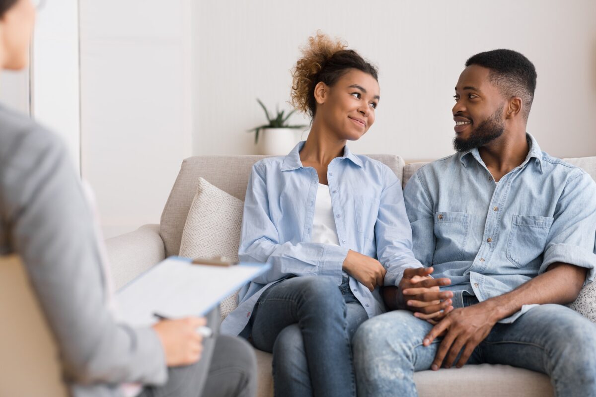 Loving Black Couple Visiting Therapy Session At Psychologist's Office
