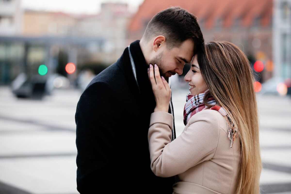 young couple hugging on the street in Wroclaw